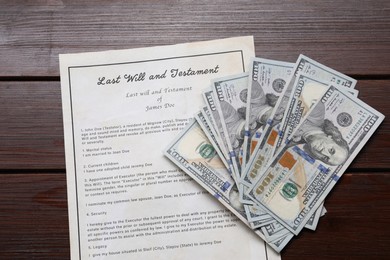Photo of Last Will and Testament with dollar bills on wooden table, top view