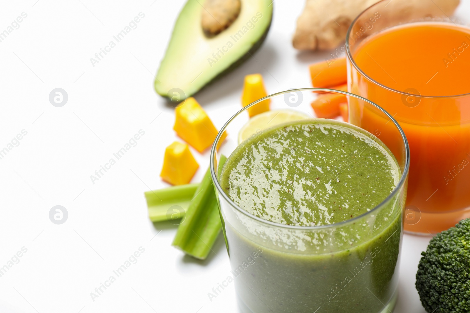 Photo of Delicious vegetable juices and fresh ingredients on white background, closeup