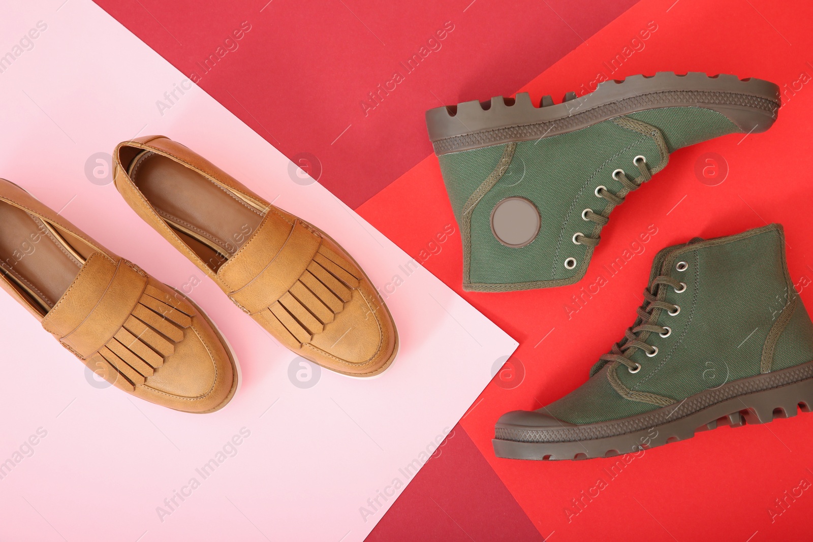 Photo of Different shoes on color background