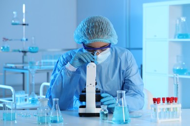 Photo of Scientist working with microscope in laboratory. Medical research