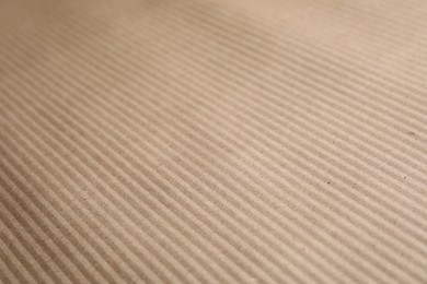 Brown corrugated sheet of cardboard as background, closeup
