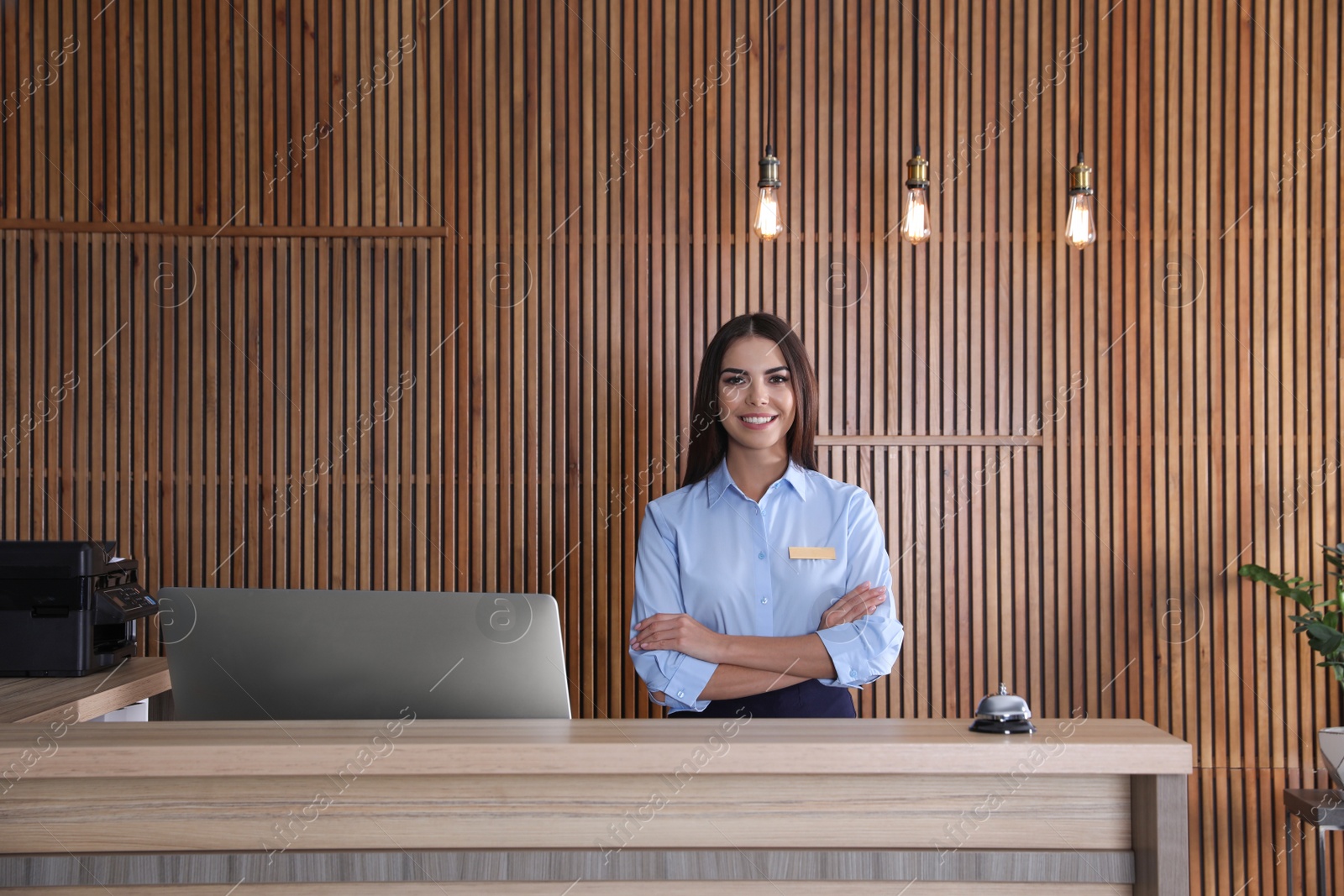 Photo of Portrait of receptionist at desk in lobby