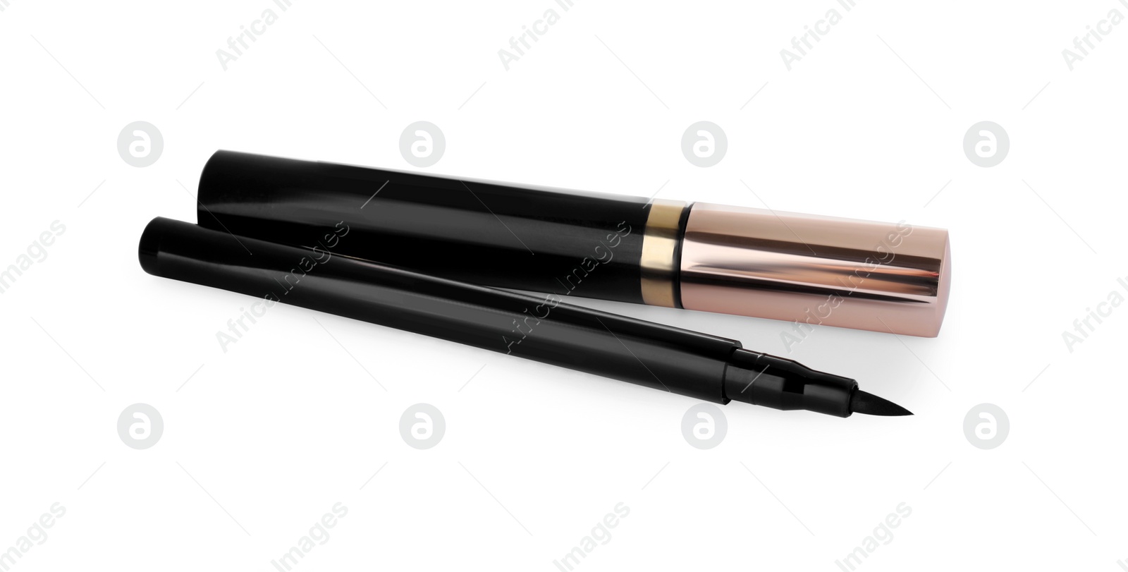 Photo of Eyeliner marker and mascara on white background. Makeup product