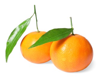 Fresh ripe juicy tangerines with green leaves isolated on white