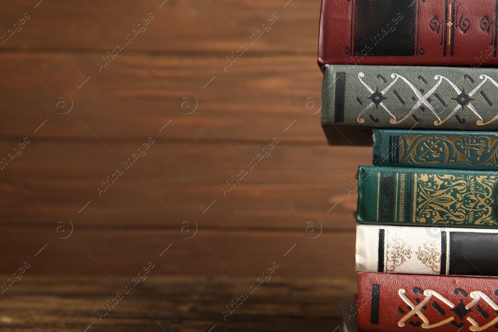 Photo of Collection of old books on shelf. Space for text