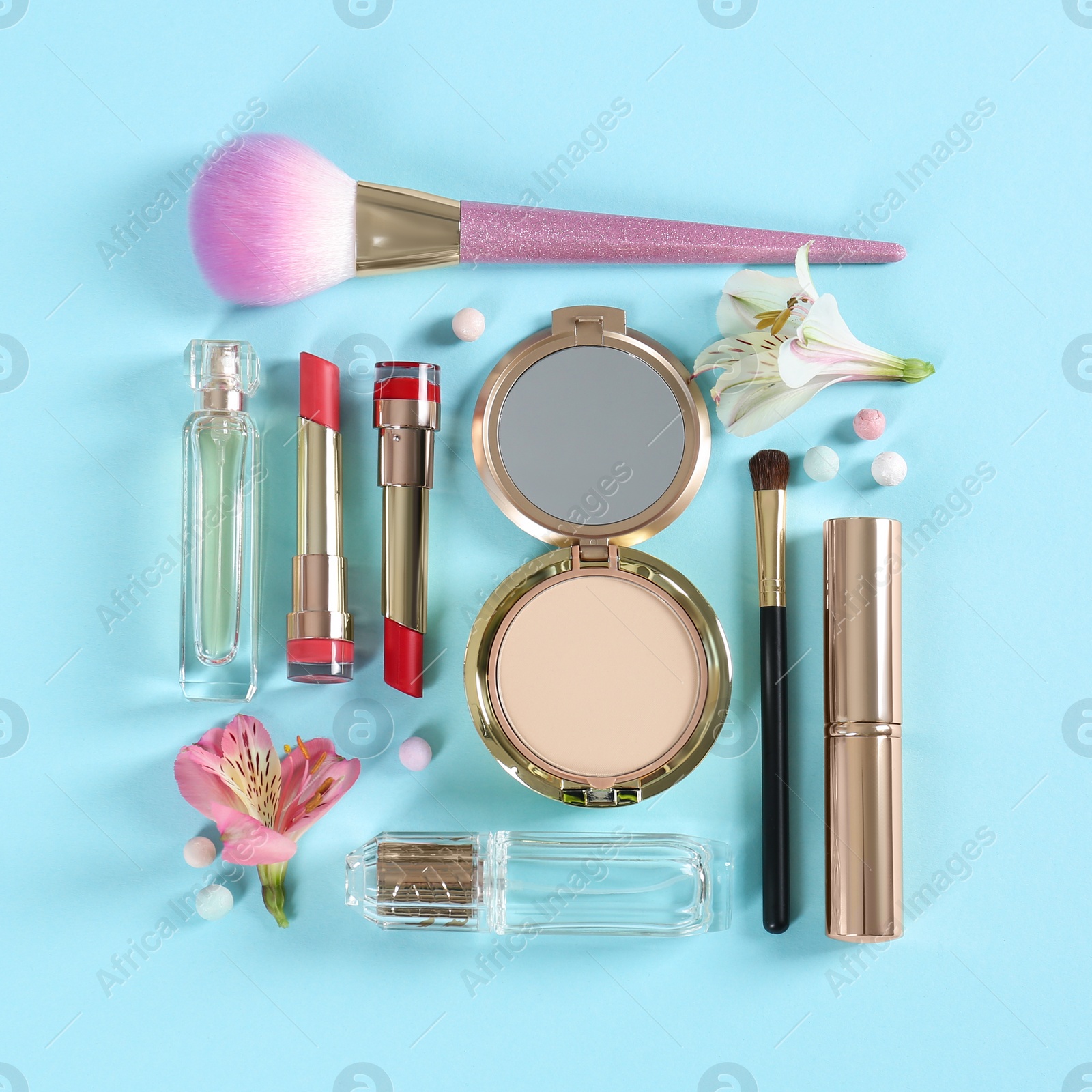 Photo of Flat lay composition with different decorative cosmetics and flowers on color background. Trendy makeup products