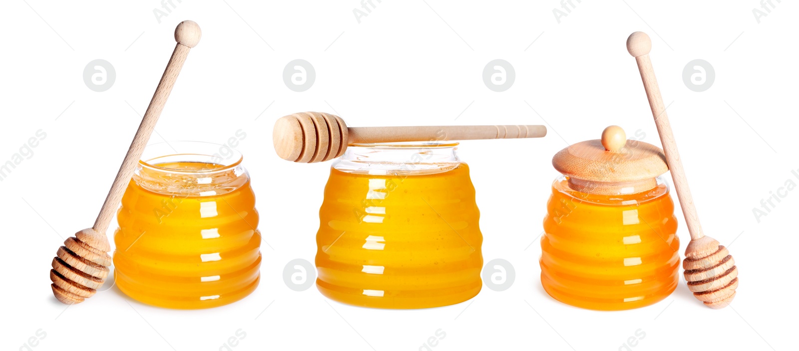 Image of Natural honey in glass jars and dippers isolated on white, set