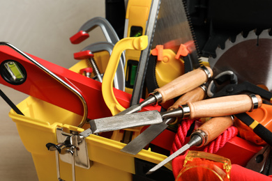 Box with different carpenter's tools, closeup view