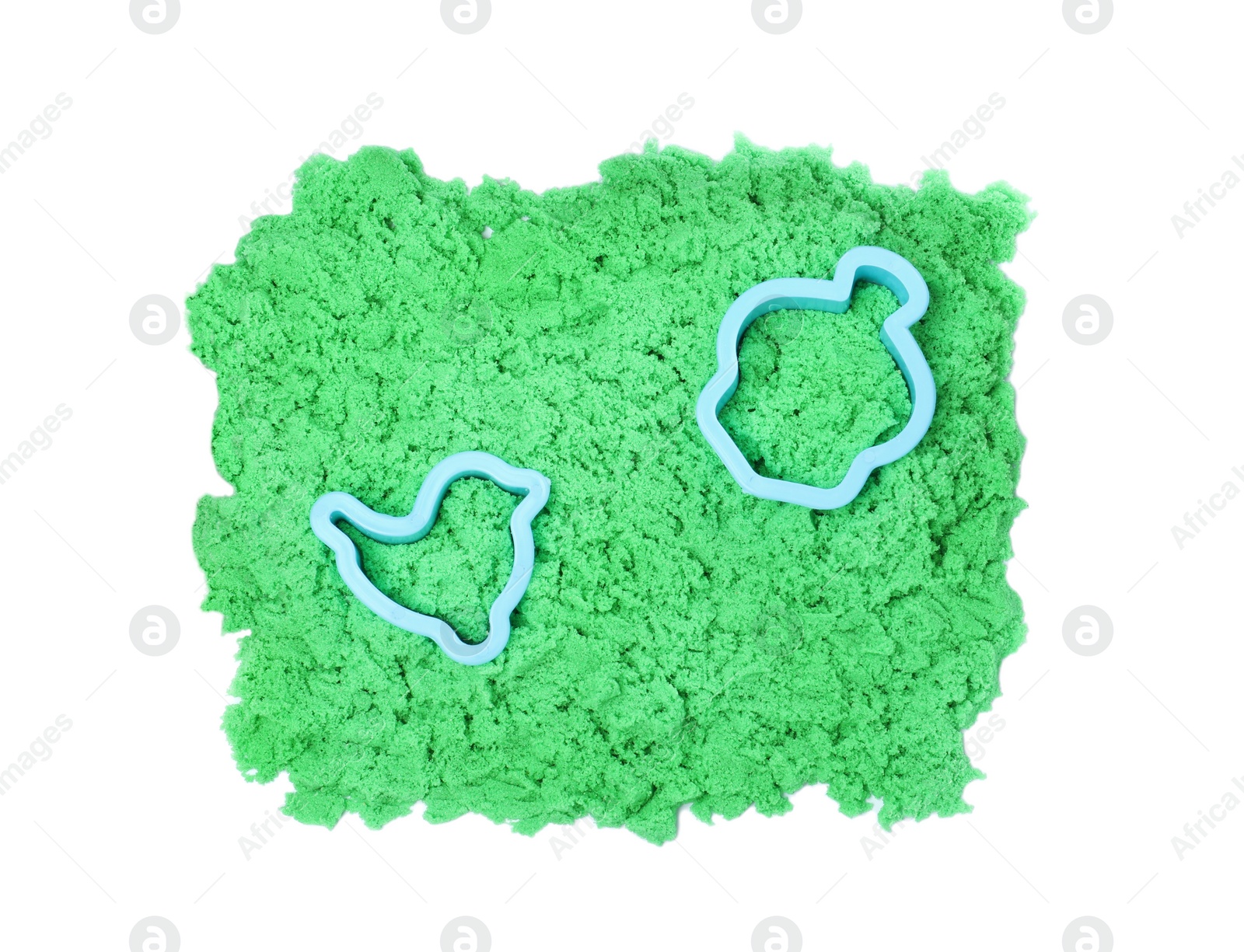 Photo of Green kinetic sand and toys on white background, top view