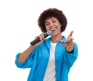 Curly young woman with microphone singing on white background