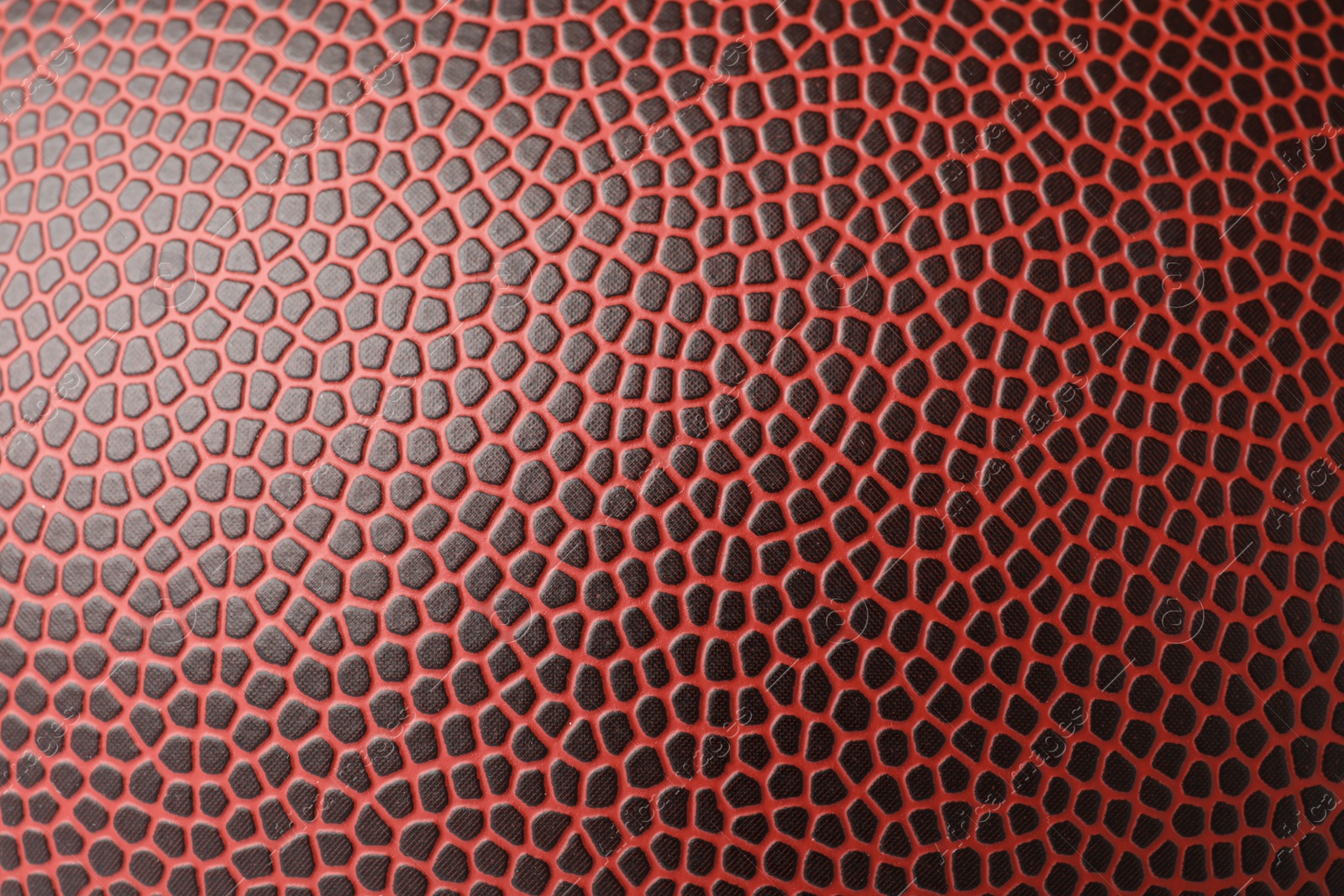 Photo of Leather American football ball as background, closeup