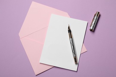 Photo of Blank sheet of paper, letter envelope and pen on violet background, top view