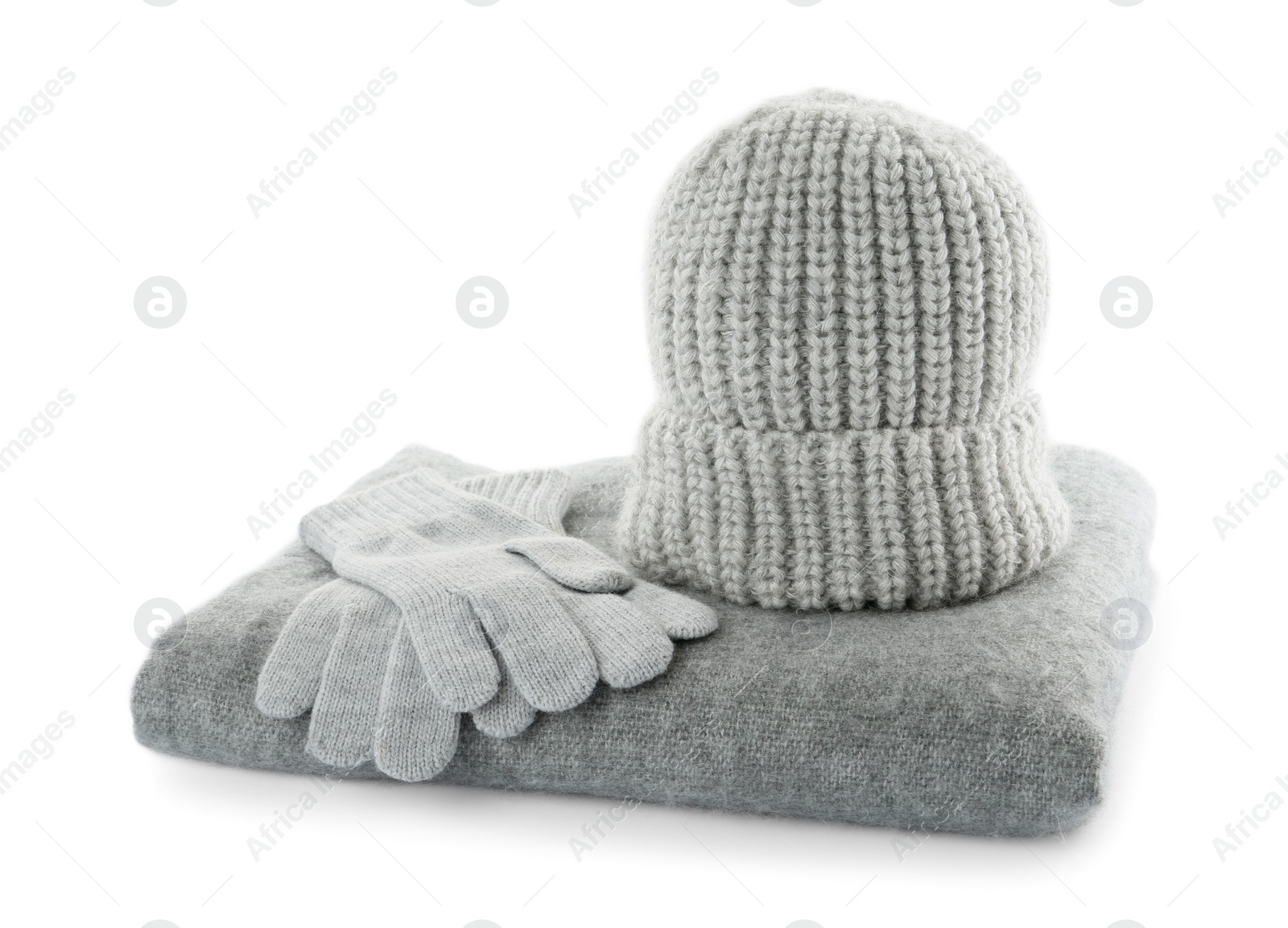 Photo of Woolen gloves, hat and scarf on white background. Winter clothes