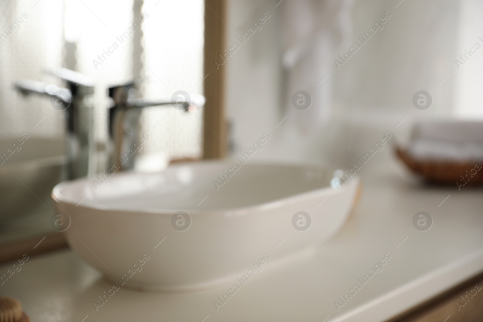 Photo of Blurred view of light modern bathroom interior