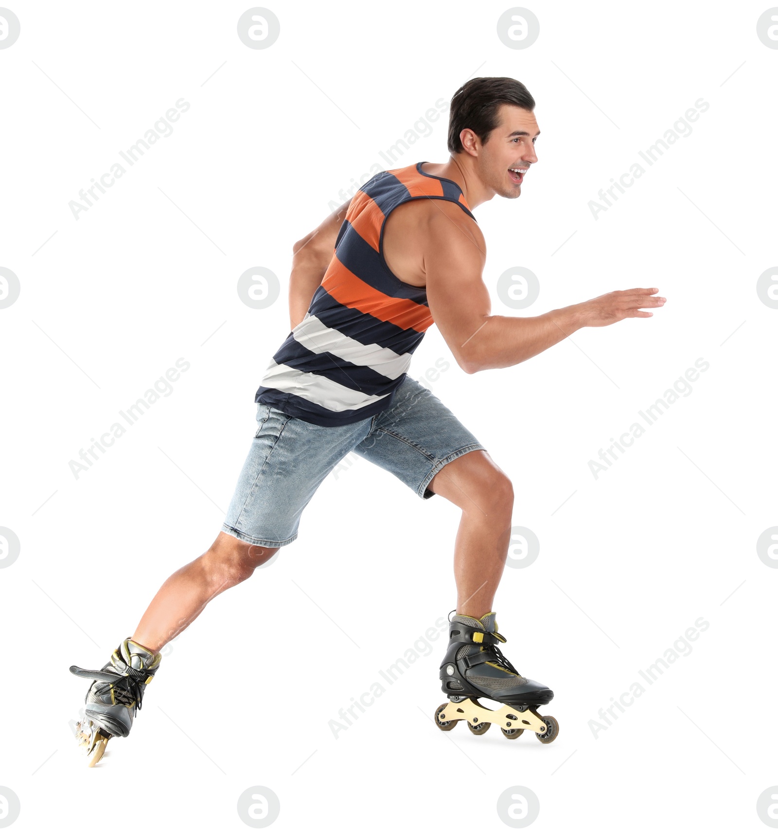 Photo of Handsome young man with inline roller skates on white background