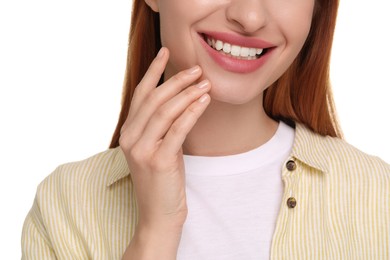 Woman with clean teeth smiling on white background, closeup