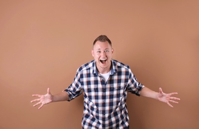 Portrait of handsome man on color background