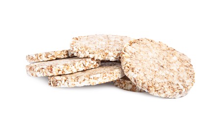 Photo of Many crunchy buckwheat cakes on white background