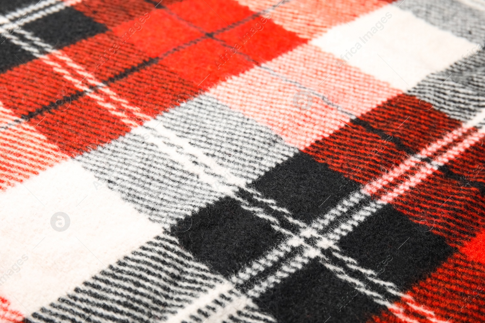 Photo of Soft warm checkered plaid as background, closeup