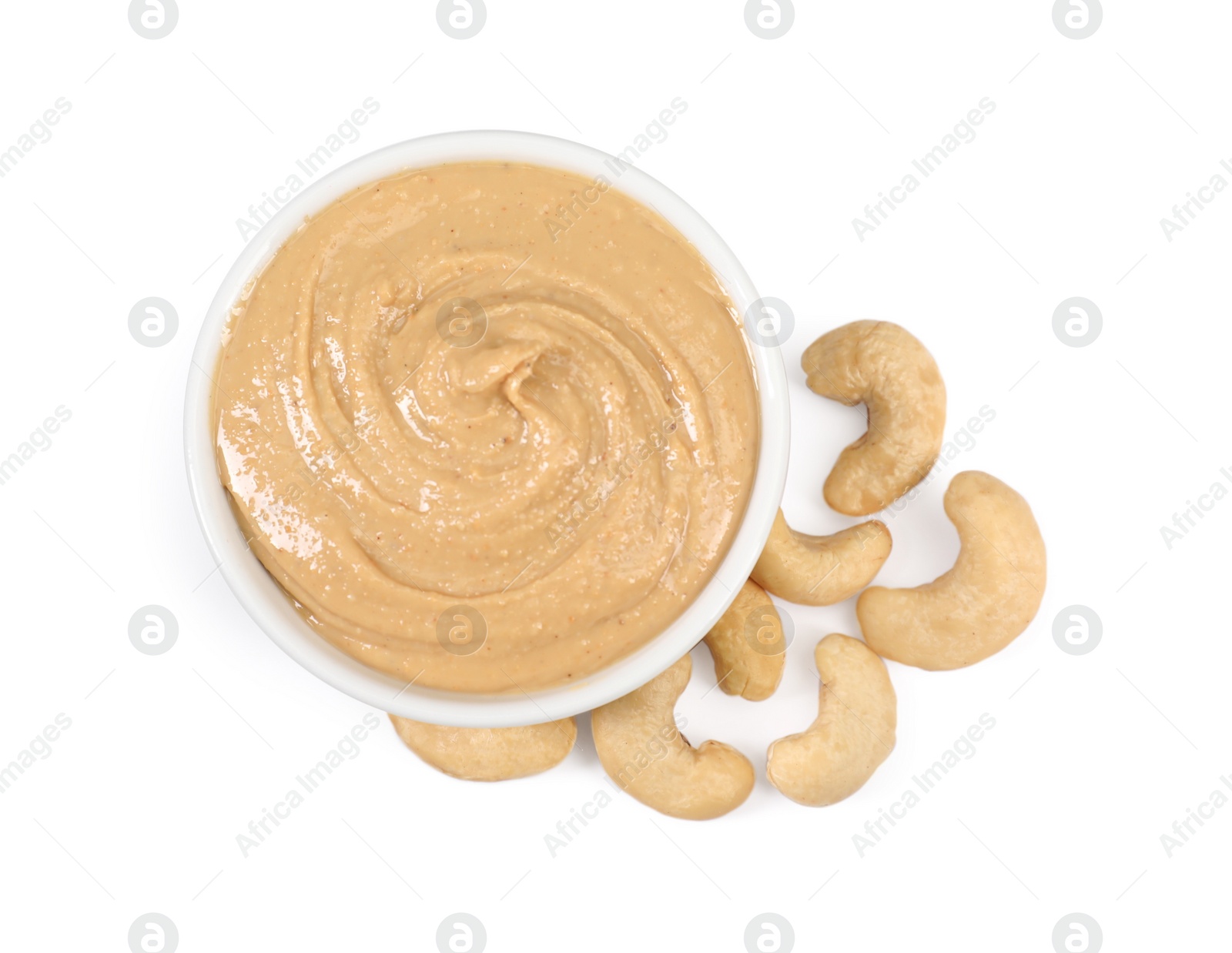 Photo of Delicious nut butter and cashews isolated on white, top view