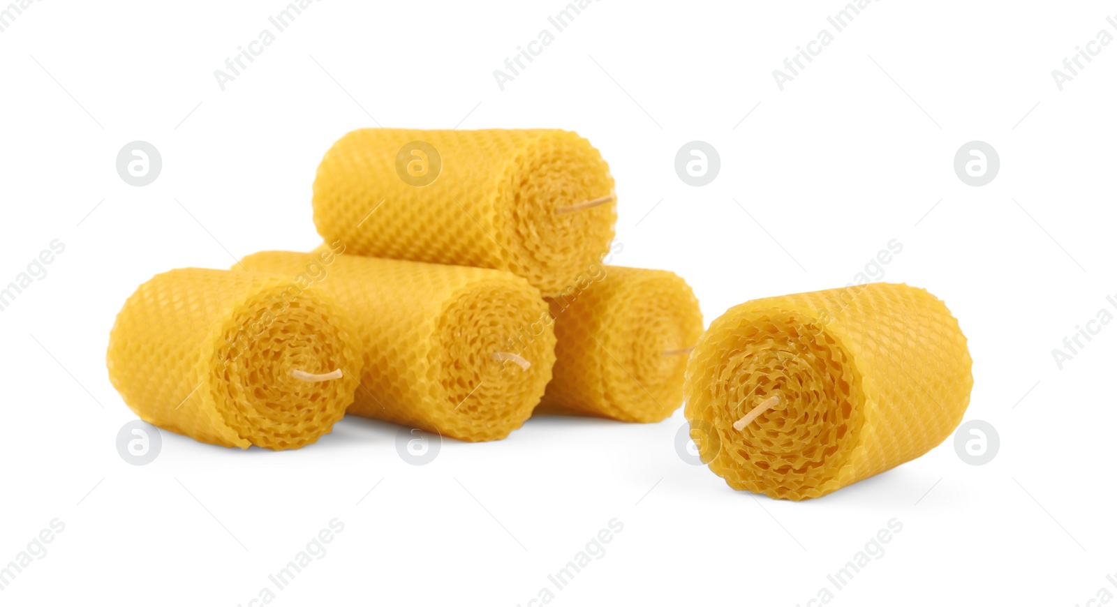 Photo of Stylish elegant beeswax candles isolated on white