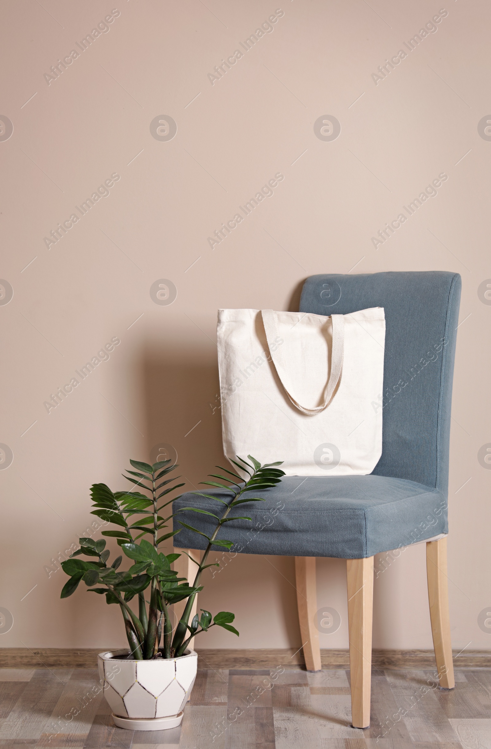 Photo of Eco tote bag in room interior. Space for design