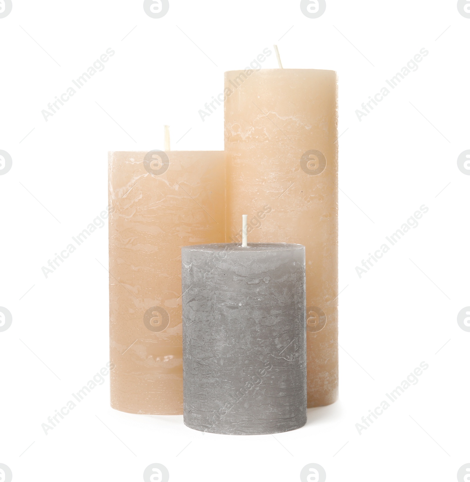 Photo of Three color wax candles on white background