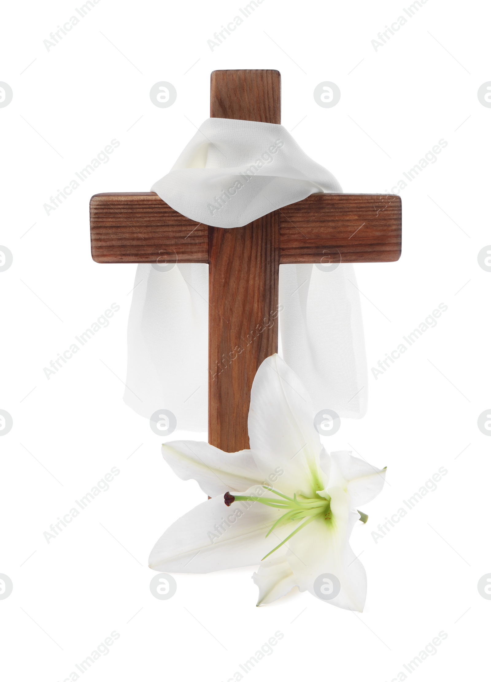 Photo of Wooden cross, cloth and lily flower on white background. Easter attributes