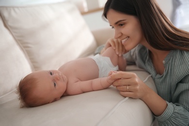 Mother with her newborn baby at home