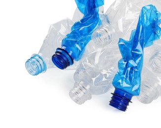 Photo of Crumpled disposable plastic bottles on white background, space for text