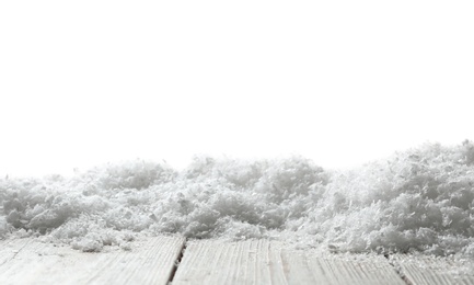 Wooden surface covered with snow against white background