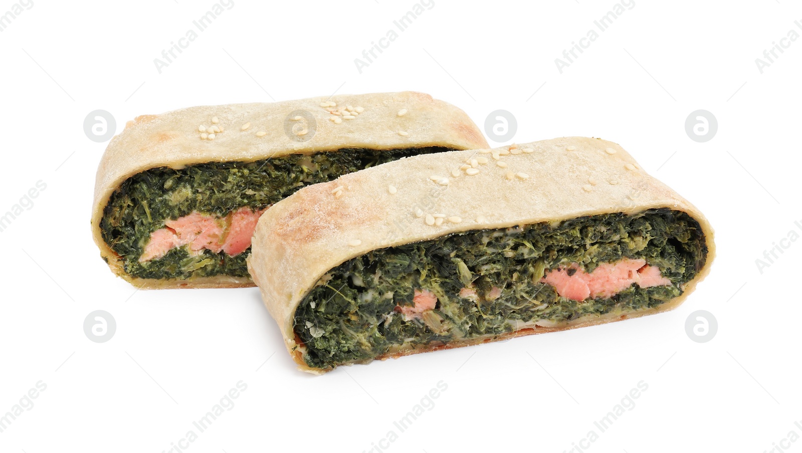 Photo of Pieces of delicious strudel with salmon and spinach isolated on white