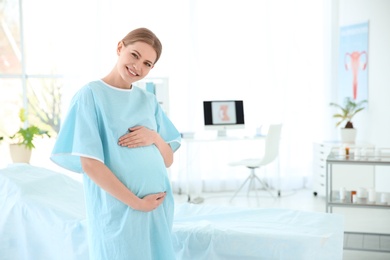 Photo of Gynecology consultation. Pregnant woman in modern clinic