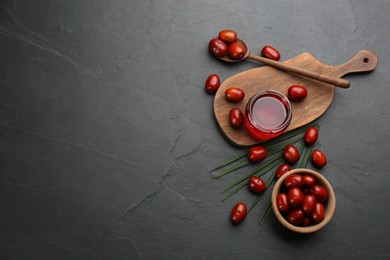 Photo of Flat lay composition with palm oil and fresh fruits on black table. Space for text
