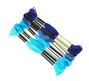 Photo of Set of colorful embroidery threads on white background, top view