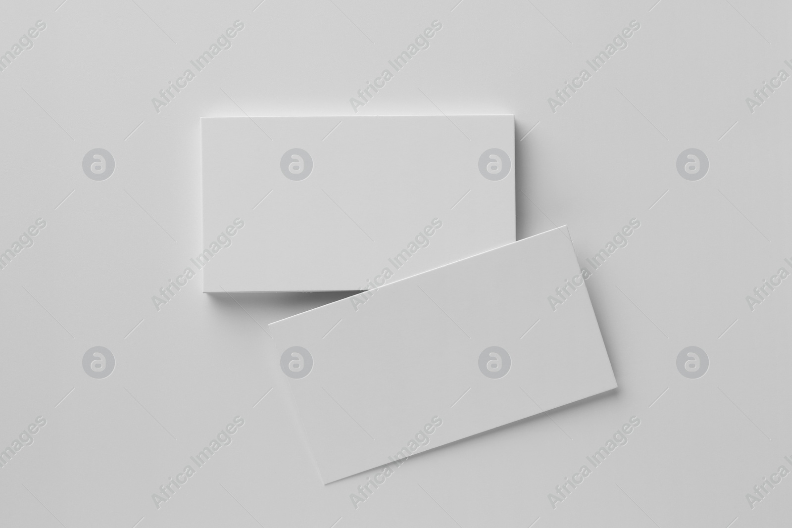 Photo of Blank business cards on white background, top view. Mockup for design