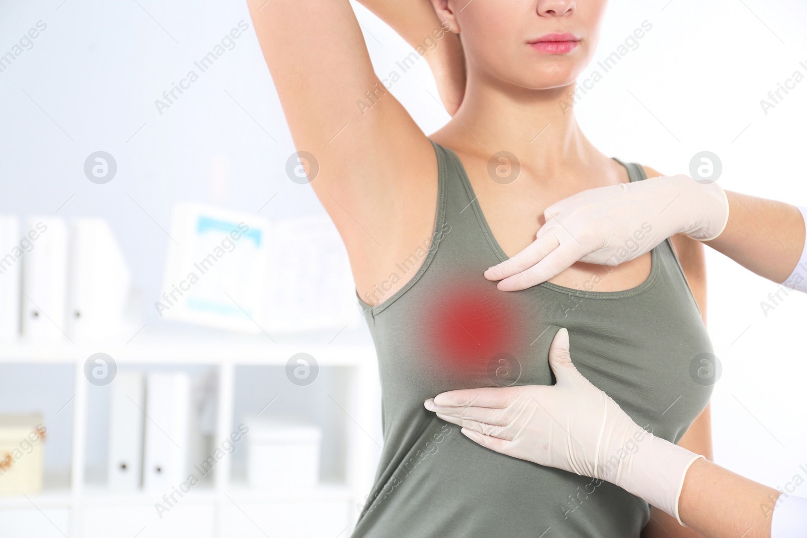 Image of Doctor checking woman's breast at hospital, closeup
