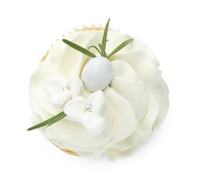 Tasty Easter cupcake with vanilla cream isolated on white, top view