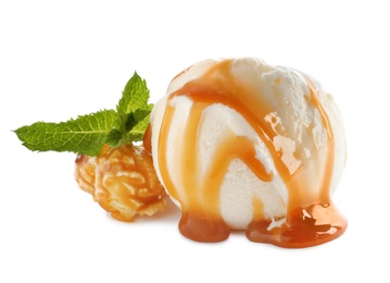 Photo of Scoop of delicious ice cream with caramel sauce, mint and popcorn on white background