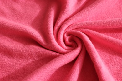 Photo of Beautiful pink fabric as background, top view