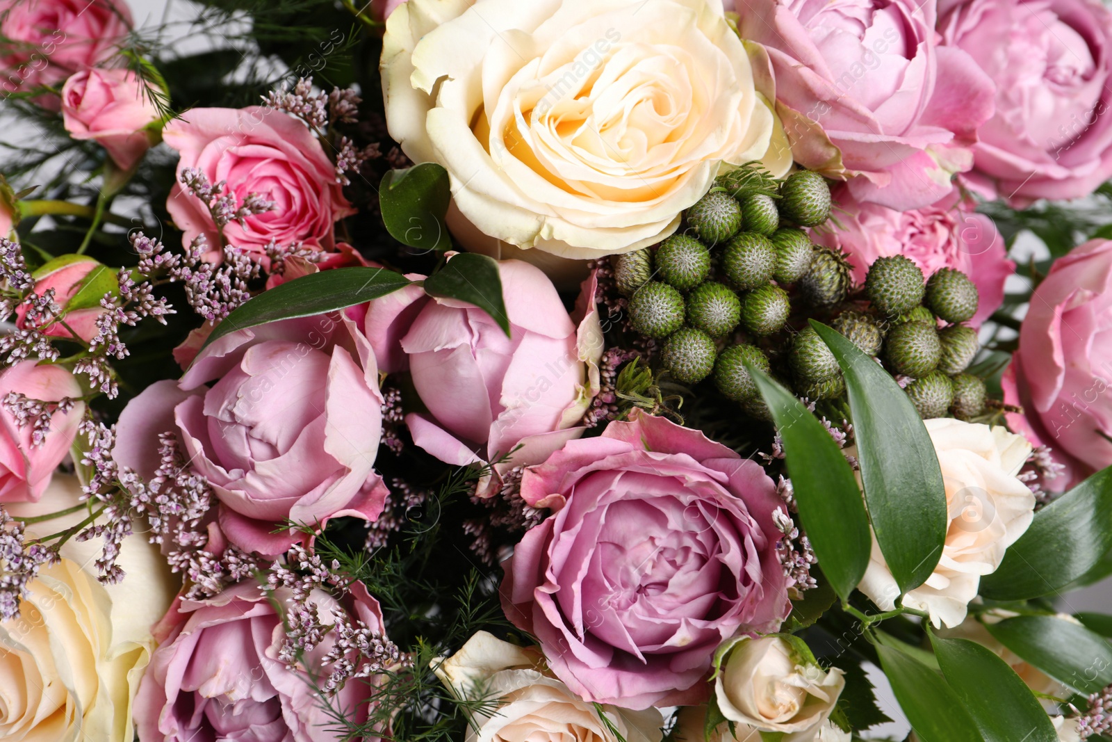 Photo of Beautiful bouquet with roses as background, closeup