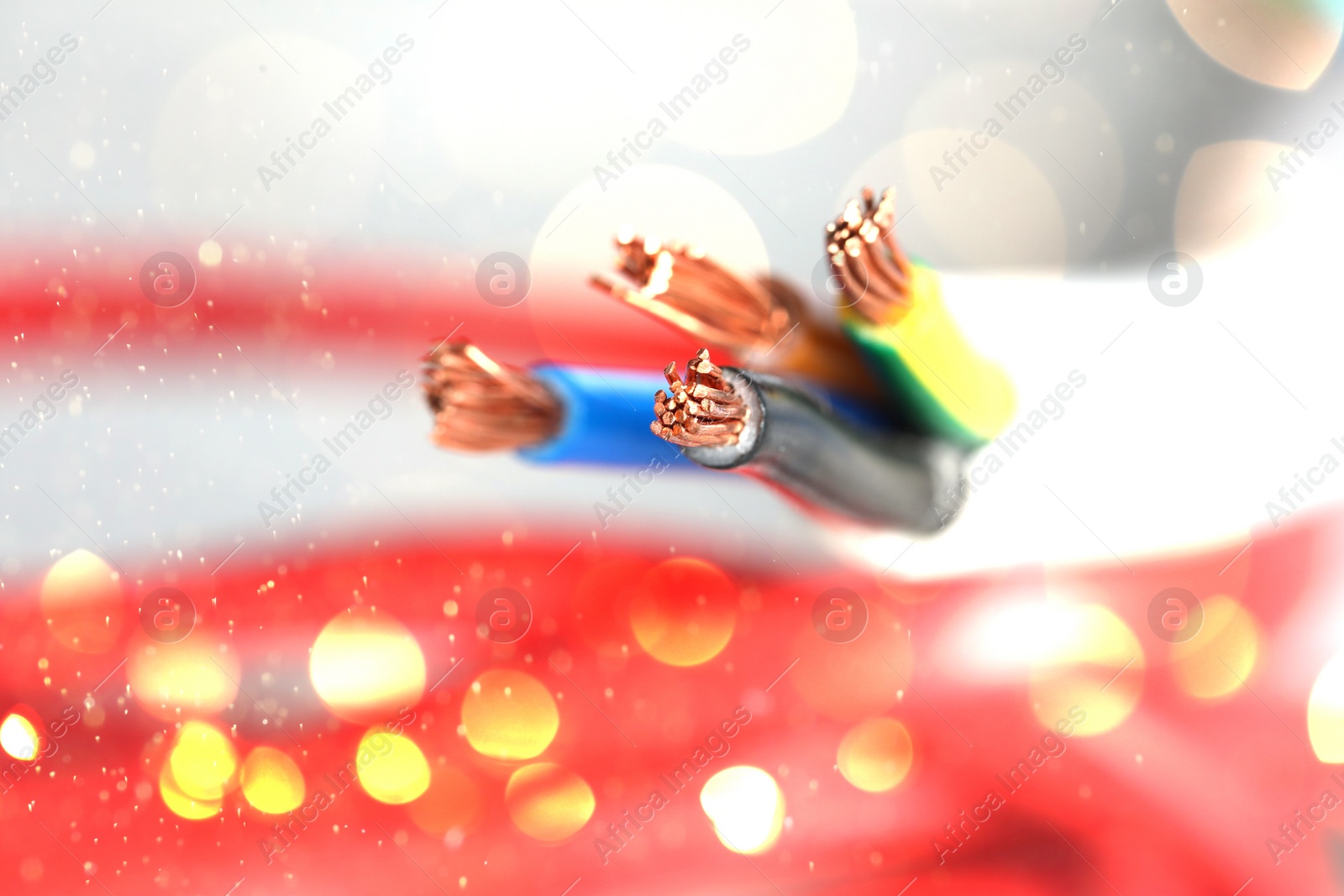 Image of Colorful electrical wires against blurred background, closeup. Bokeh effect