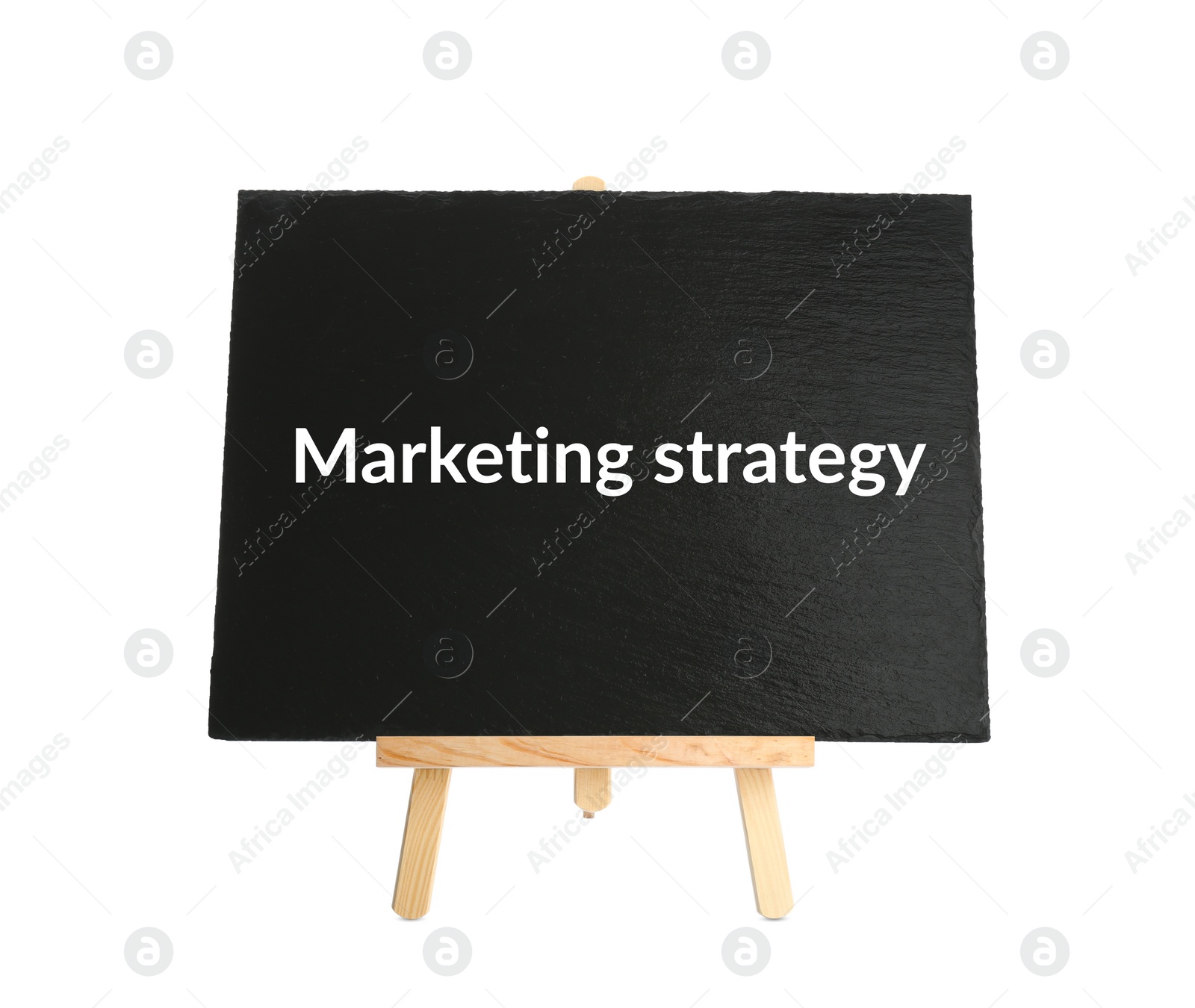 Image of Blackboard with phrase MARKETING STRATEGY on wooden easel against white background