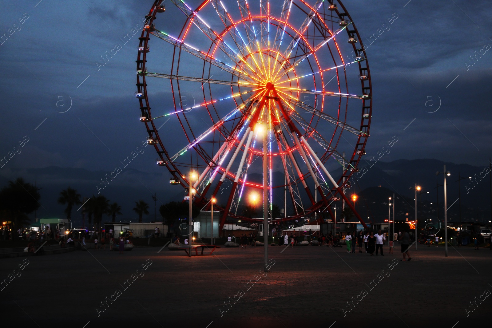 Photo of Beautiful glowing Ferris wheel in amusement park