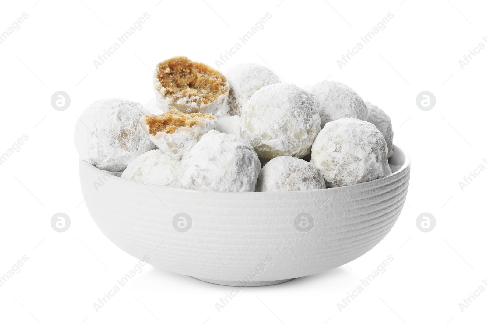 Photo of Tasty Christmas snowball cookies in bowl isolated on white
