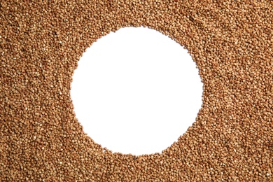 Uncooked buckwheat and space for text on white background, top view