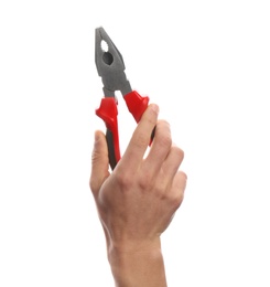 Male plumber holding pliers on white background, closeup