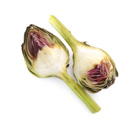 Photo of Pieces of fresh raw artichoke on white background, top view