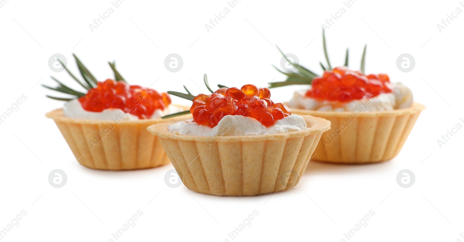 Photo of Delicious tartlets with red caviar and cream cheese on white background