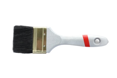 Photo of Paint brush with wooden handle and dark bristle on white background
